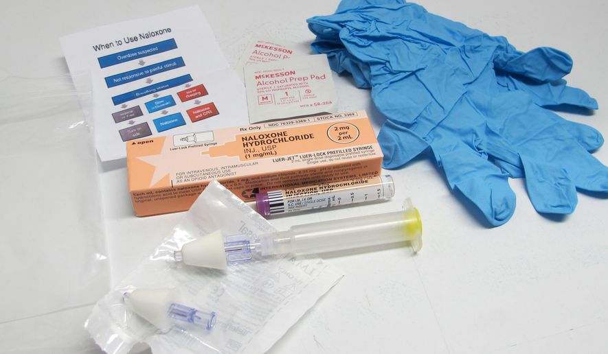 In this May 13, 2015 photo, the contents of a drug overdose rescue kit is seen at a training session in Buffalo, N.Y., on how to administer naloxone, which reverses the effects of heroin and prescription painkillers. The kits are being provided to community members in Erie County who seek training in how to recognize a potential drug overdose and administer naloxone, which reverses the effects of heroin and prescription painkillers. New York and other states have been equipping lay people, as well first responders and families of addicts, with naloxone in an effort to increase the chances it will be there when needed. (AP Photo/Carolyn Thompson)