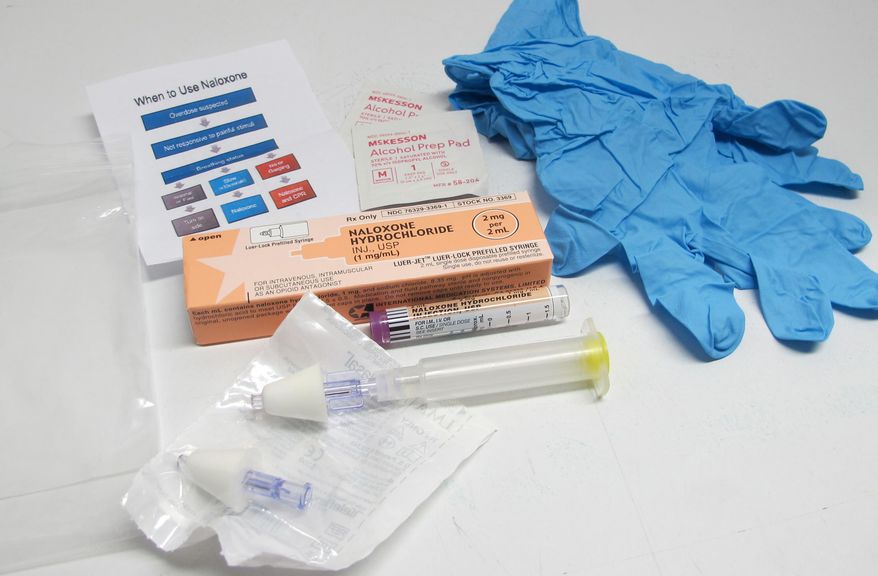 In this May 13, 2015 photo, the contents of a drug overdose rescue kit is seen at a training session in Buffalo, N.Y., on how to administer naloxone, which reverses the effects of heroin and prescription painkillers. The kits are being provided to community members in Erie County who seek training in how to recognize a potential drug overdose and administer naloxone, which reverses the effects of heroin and prescription painkillers. New York and other states have been equipping lay people, as well first responders and families of addicts, with naloxone in an effort to increase the chances it will be there when needed. (AP Photo/Carolyn Thompson)