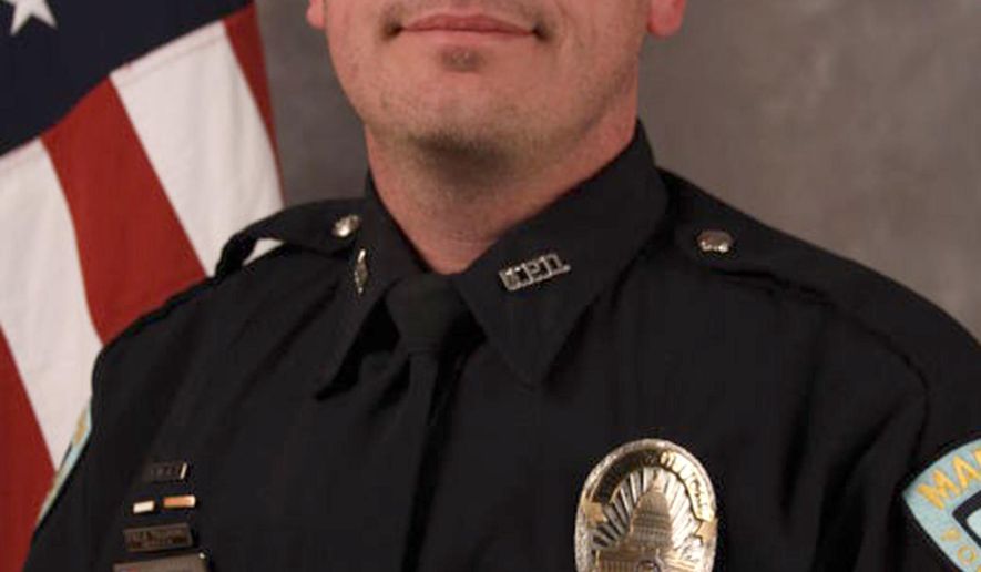 FILE - This undated file photo provided by the Madison, Wis., Police Department shows Officer Matt Kenny. Kenny, who won't face criminal charges in the fatal shooting of an unarmed 19-year-old man in Madison on March 6, 2015, wants to return to his job, but the police chief fears for his safety. (AP Photo/Madison Police Department, File)
