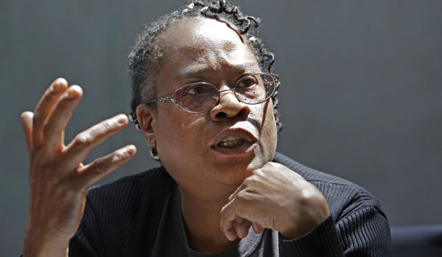 In this May 14, 2015 photo, Sheila Beasley, a 50-year-old Bronx woman with no criminal history, discusses her case against the New York city police department at her attorney's office in the Brooklyn borough of New York. In December, 2008, Beasley briefly dropped a leash with her pet Rottweiler at the other end, and received a summons from a plain clothes police officer. Two years later she was tracked down and arrested on an open warrant for not answering her summons, and placed into custody for four days. William Bratton, New York City’s police commissioner, tells The Associated Press he’s open to discussing some kind of program that notifies people and offers to make their arrest warrants go away if they come forward. (AP Photo/Kathy Willens)
