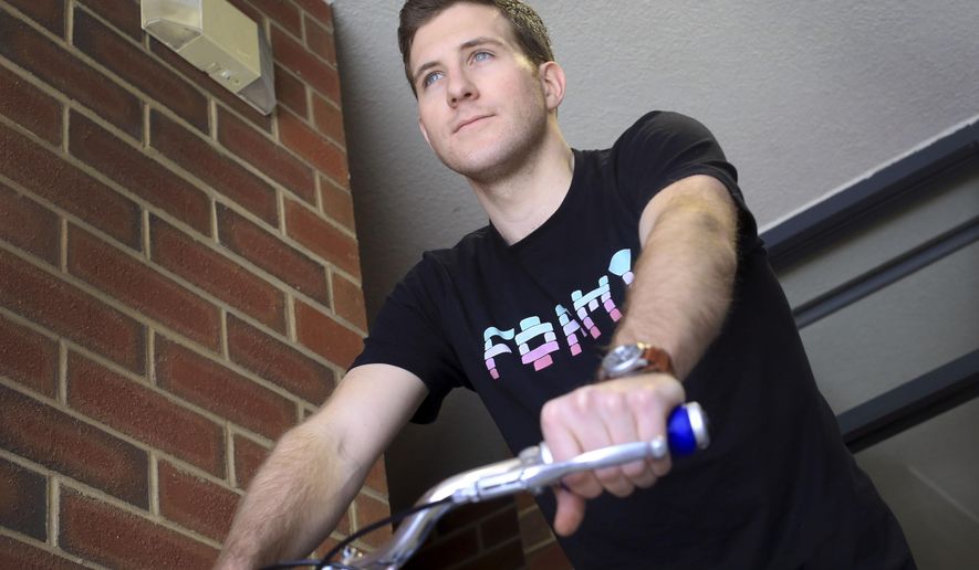 ADVANCE FOR USE MONDAY, MAY 18 - In this photo taken April, 28, 2015, Virginia Tech student Richard “Sky” Van Iderstine poses on his bicycle in Blacksburg, Va. Iderstine won a Virginia Tech student entrepreneur of the year award and launched a couple small companies. He designs and makes leather strap watch bands, and a makes and sells custom handles for bicycles. (Matt Gentry/The Roanoke Times via AP) LOCAL TELEVISION OUT; SALEM TIMES REGISTER OUT; FINCASTLE HERALD OUT; CHRISTIANBURG NEWS MESSENGER OUT; RADFORD NEWS JOURNAL OUT; ROANOKE STAR SENTINEL OUT