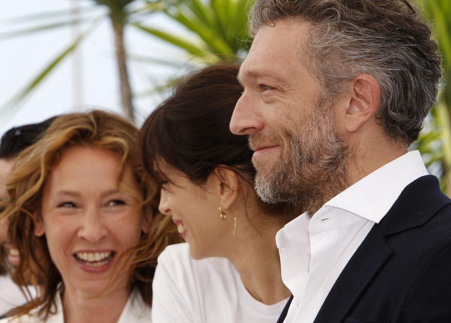 From right, actor Vincent Cassel, director Maiwenn, and actress Emmanuelle Bercot during a photo call for the film Mon Roi (My King), at the 68th international film festival, Cannes, southern France, Sunday, May 17, 2015. (AP Photo/Lionel Cironneau)