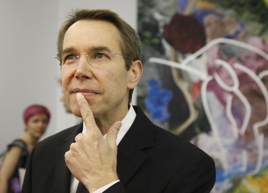 FILE - In this April 23, 2010 file photo, artist Jeff Koons poses for photographers at the Pinchuk Art Center in Kiev, Ukraine. Jeff Koons has agreed to auction off his "Coloring Book" sculpture at the amfAR gala during the 68th Cannes international film festival. (AP Photo/Efrem Lukatsky, File)