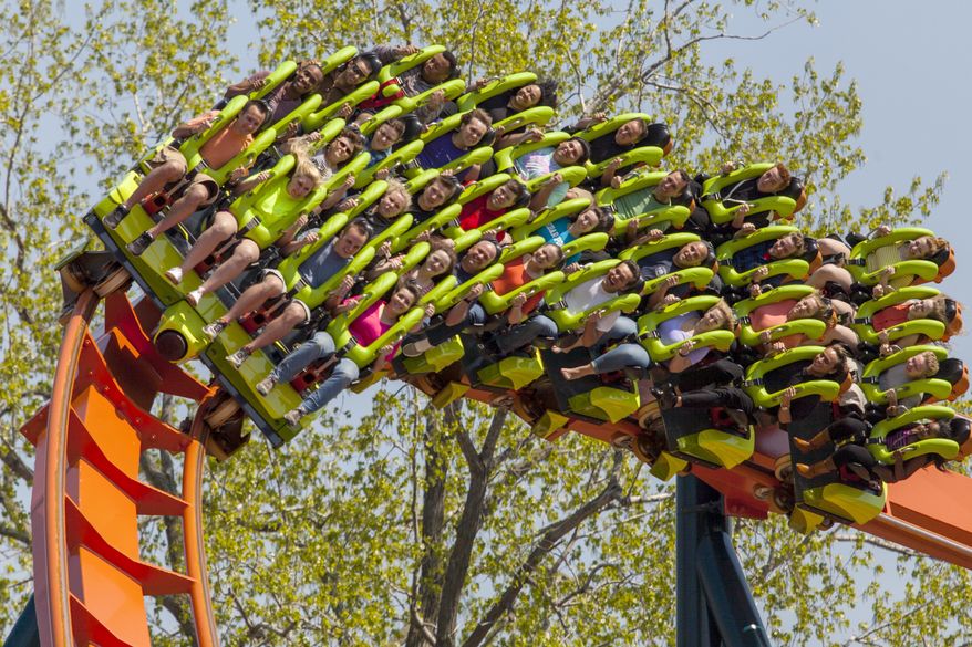 This photo provided by Cedar Point in Sandusky, Ohio, shows the theme park’s new Rougarou roller coaster. The floorless coaster has a werewolf theme. It’s one of a number of new attractions at theme parks around the country this summer. (AP Photo/Cedar Point)