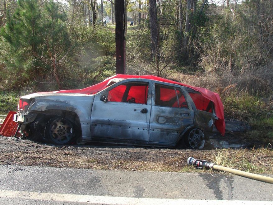 FILE - This March 6, 2012 file photo provided by the law offices of Butler, Wooten & Fryhofer, LLP shows a burnt-out Jeep Grand Cherokee at the scene of a crash in Bainbridge, Ga. 4-year-old Remington "Remi" Walden was killed when the vehicle exploded into flames after being rear-ended. The U.S. government’s highway safety agency says it will hold a public hearing on July 2, 2015 to determine if Fiat Chrysler has met its legal obligations in 20 safety recalls. (Courtesy of Butler, Wooten & Fryhofer, LLP via AP, File)