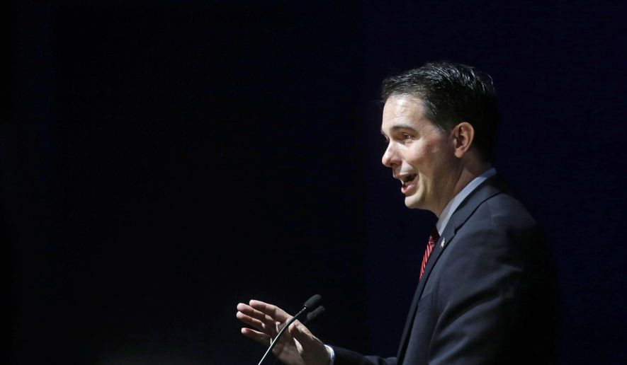 Wisconsin Governor Scott Walker speaks to the American Federation For Children in New Orleans, Monday, May 18, 2015. (AP Photo/Gerald Herbert)