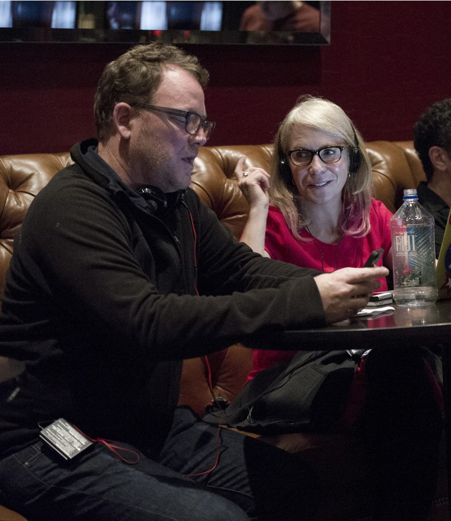 This image released by Bravo shows executive producer Robert Duncan McNeill, left, and Marti Noxon writer-producer of "The Girlfriends Guide to Divorce." Showrunners, formally known as executive producers, generally arise from the ranks of writers. Although women are underrepresented as TV writers _ holding less than a third of cable and broadcast jobs, according to the latest Writers Guild of America study _ the ones who rise to the top can pull other women along. (Carole Segal/Bravo via AP)