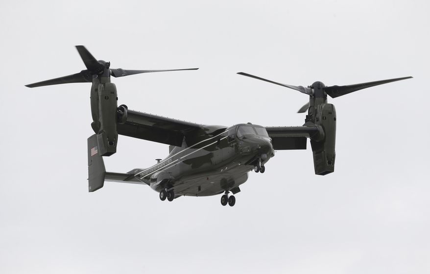 In this April 22, 2015 photo, a Marine Corps MV-22 Osprey comes in for a landing at Miami International Airport before a presidential visit, in Miami. A fatal crash of a U.S. Marine Corps aircraft in Hawaii has renewed safety concerns in Japan, where more of the Ospreys will be deployed. A tilt-rotor MV-22 Osprey caught fire after a hard landing on Sunday, May 17, 2015, killing one Marine and injuring 21 others at Bellows Air Force Station on Hawaii’s main island of Oahu. (AP Photo/Wilfredo Lee)