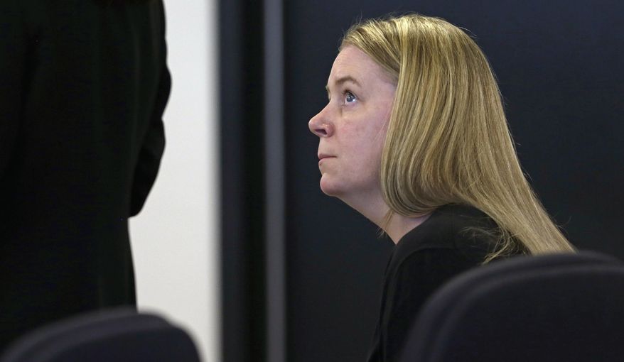 Aisling Brady McCarthy watches as her attorney addresses the court during a status hearing at Middlesex Superior Court in Woburn, Mass., Tuesday, May 19, 2015. McCarthy, a nanny from Ireland, is accused of killing a 1-year-old Massachusetts girl in her care two years ago. (AP Photo/Charles Krupa, Pool)