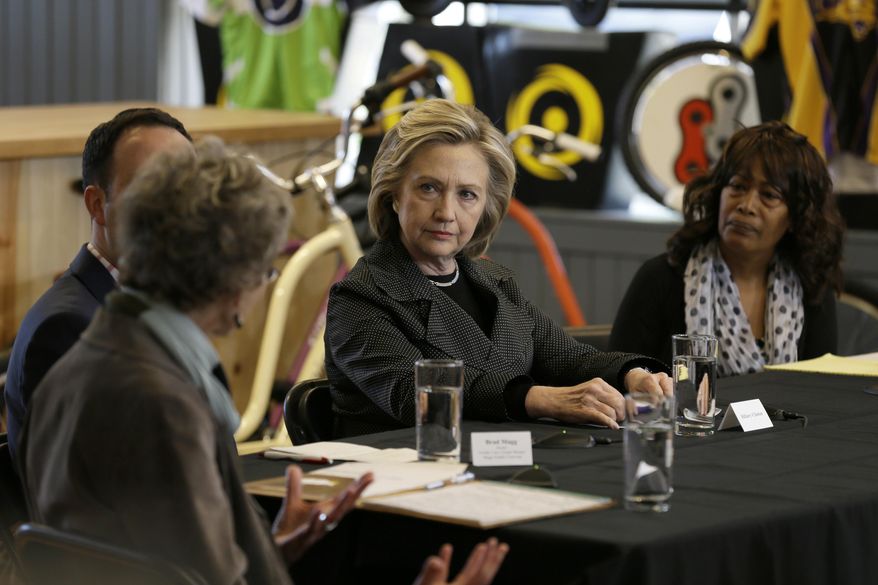Democratic presidential candidate Hillary Rodham Clinton listens to small business owners, Tuesday, May 19, 2015, at the Bike Tech cycling shop in Cedar Falls, Iowa. (AP Photo/Charlie Neibergall)