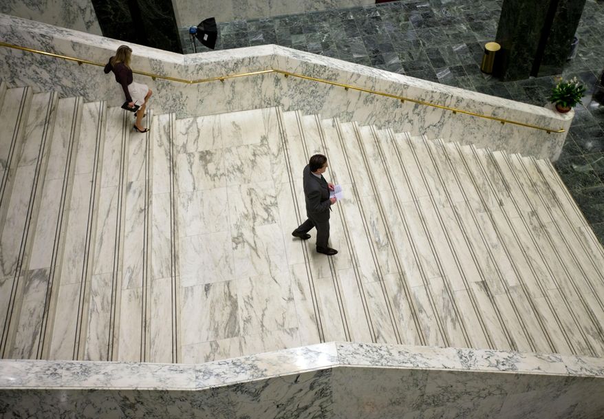 Senate Majority Leader John Flanagan, R-Smithtown, walks down a staircase at the Legislative Office Building after speaking at a property tax-cap news conference on Tuesday, May 19, 2015, in Albany, N.Y. (AP Photo/Mike Groll)