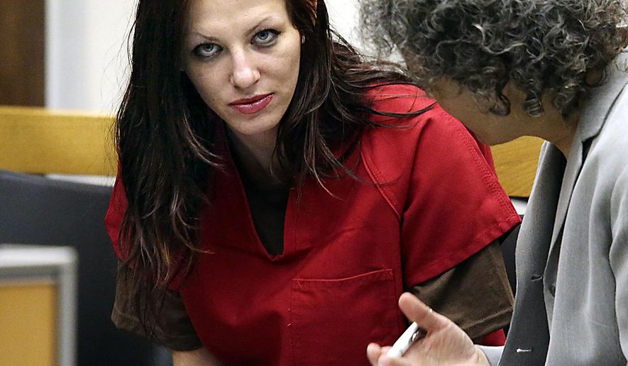 FILE -In this July 9, 2014 file photo, Alix Tichelman, left, of Folsom, Calif., confers with public defender Diane August during her arraignment in Santa Cruz Superior Court in Santa Cruz, Calif. Tichelman, a prostitute charged with killing a Google executive with an overdose of heroin aboard his yacht, pleaded guilty Tuesday, May 19, 2015, to involuntary manslaughter and administering drugs. A Santa Cruz County Superior Court judge sentenced Tichelman to six years in prison. (AP Photo/Santa Cruz Sentinel, Shmuel Thaler, File)