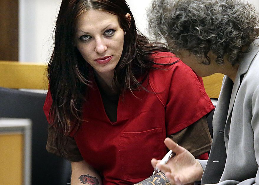 FILE -In this July 9, 2014 file photo, Alix Tichelman, left, of Folsom, Calif., confers with public defender Diane August during her arraignment in Santa Cruz Superior Court in Santa Cruz, Calif. Tichelman, a prostitute charged with killing a Google executive with an overdose of heroin aboard his yacht, pleaded guilty Tuesday, May 19, 2015, to involuntary manslaughter and administering drugs. A Santa Cruz County Superior Court judge sentenced Tichelman to six years in prison. (AP Photo/Santa Cruz Sentinel, Shmuel Thaler, File)