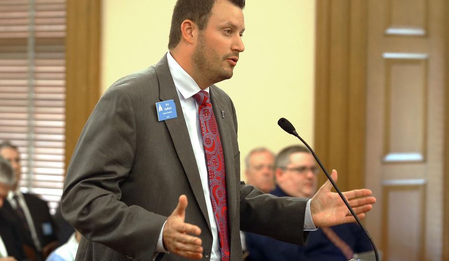 Eric Stafford, with the Kansas Chamber of Commerce, testifies Tuesday, May, 19,2015, in Topeka, Kan., before the House Tax Committee in opposition to a bill that would roll back tax exemptions on business income but maintain tax-free status for income up to $150,000. (Thad Allton/The Topeka Capital-Journal via AP)