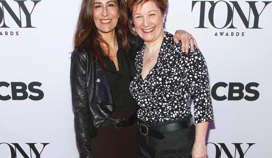 FILE - In this April 29, 2015 file photo, Jeanine Tesori, left, and Lisa Kron, from "Fun Home" attend the 2015 Tony Awards Meet the Nominees press junket in New York. Tesori and Kron can make history when the Tony awards are announced next month. If they win, the pair will become the first female writing team to nab a Tony for best musical score. (Photo by Andy Kropa/Invision/AP, File)
