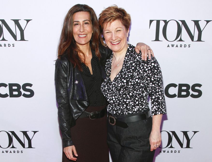 FILE - In this April 29, 2015 file photo, Jeanine Tesori, left, and Lisa Kron, from "Fun Home" attend the 2015 Tony Awards Meet the Nominees press junket in New York. Tesori and Kron can make history when the Tony awards are announced next month. If they win, the pair will become the first female writing team to nab a Tony for best musical score. (Photo by Andy Kropa/Invision/AP, File)
