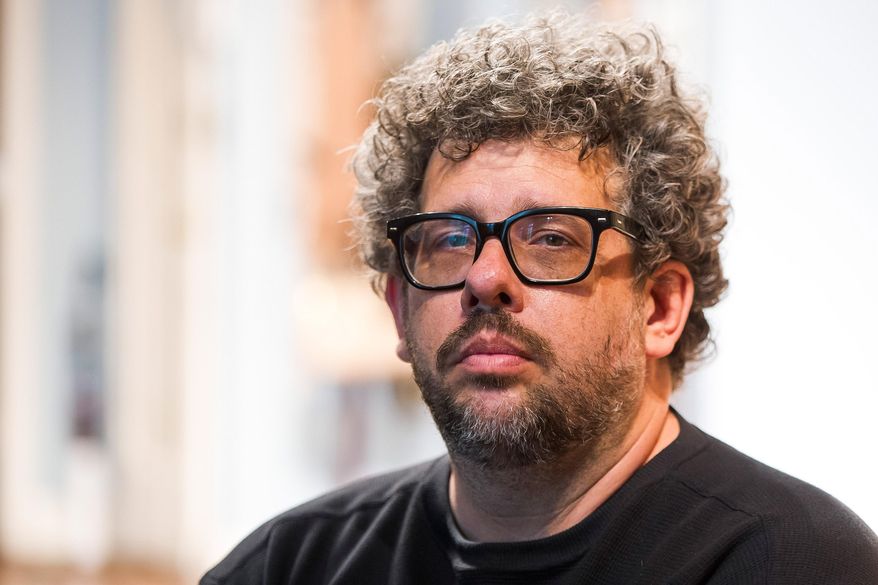 FILE - In this May 1, 2015 photo, Neil LaBute poses on the set of his new play "The Way We Get By" at the Second Stage Theatre in New York. A play festival benefiting the National Coalition Against Censorship will go on at a new location, but without the Neil LaBute play that led to the event being scrapped at its initial venue. Playwrights for a Cause said Tuesday that its festival featuring three new short plays about censorship in the arts will take place on June 14 at New York Theatre Workshop. (Photo by Charles Sykes/Invision/AP, File)