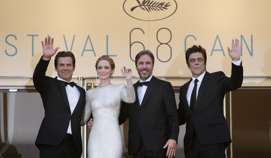 From left, actors Josh Brolin, Emily Blunt, director Denis Villeneuve and actor Benicio del Toro pose for photographers as they arrive for the screening of the film Sicario at the 68th international film festival, Cannes, southern France, Tuesday, May 19, 2015. (AP Photo/Lionel Cironneau)