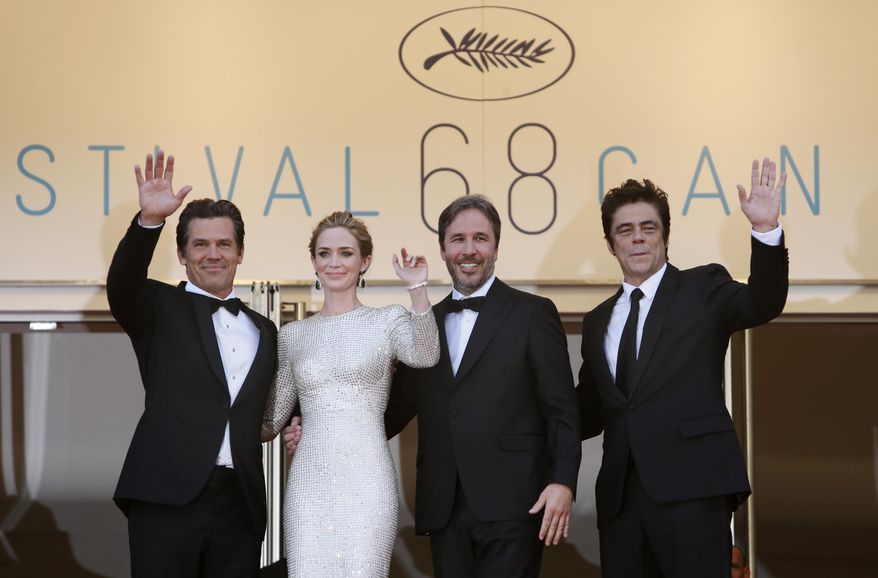 From left, actors Josh Brolin, Emily Blunt, director Denis Villeneuve and actor Benicio del Toro pose for photographers as they arrive for the screening of the film Sicario at the 68th international film festival, Cannes, southern France, Tuesday, May 19, 2015. (AP Photo/Lionel Cironneau)