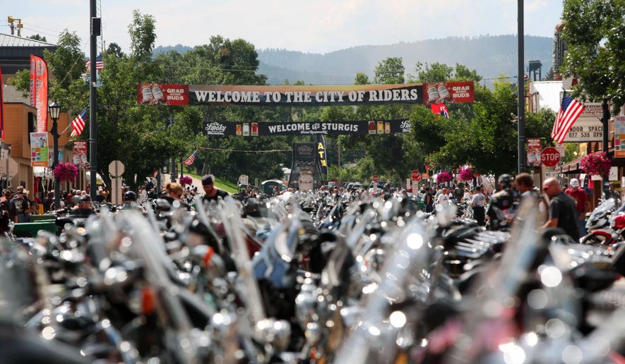 FILE - This Aug. 1, 2014 file photo shows motorcycles lined up in Sturgis, S.D., for the 74th annual Sturgis Motorcycle Rally that draws thousands of enthusiasts. A motorcycle gang shootout in Texas that left nine dead has elevated security concerns for the upcoming rally, authorities told the Argus Leader newspaper. (AP Photo/Toby Brusseau, File)