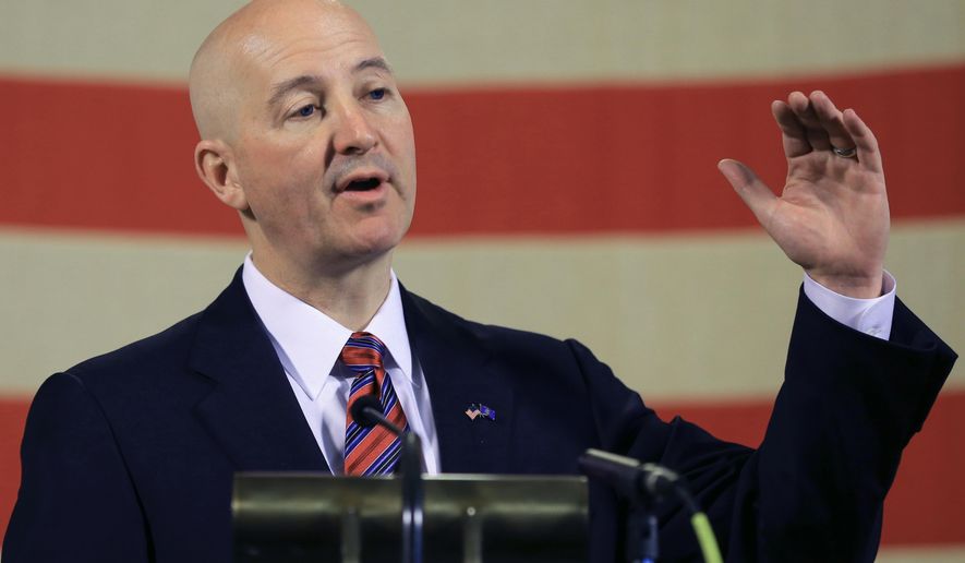 Neb. Gov. Pete Ricketts gestures during a news conference in Lincoln, Neb., Wednesday, May 20, 2015. Gov. Ricketts voiced his opposition to a bill to abolish the death penalty which is up for a final vote before the Legislature on Wednesday, and promised to veto the bill should it pass. (AP Photo/Nati Harnik)