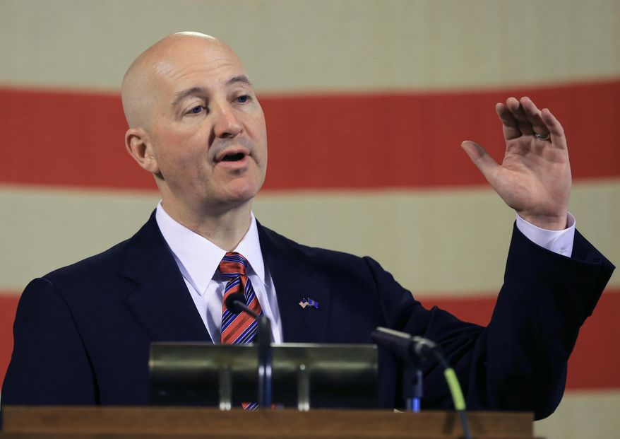 Neb. Gov. Pete Ricketts gestures during a news conference in Lincoln, Neb., Wednesday, May 20, 2015. Gov. Ricketts voiced his opposition to a bill to abolish the death penalty which is up for a final vote before the Legislature on Wednesday, and promised to veto the bill should it pass. (AP Photo/Nati Harnik)