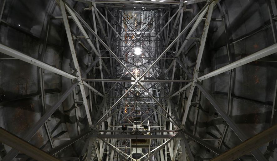 Metal beams line the inside of the Giant Uniroyal Tire in Allen Park, Mich., Wednesday, May 20, 2015. The 80-foot-high, 12-ton tire is turning 50 and has stood alongside Interstate 94, near Detroit, since 1965, a year after it debuted at the New York World’s Fair. (AP Photo/Paul Sancya)
