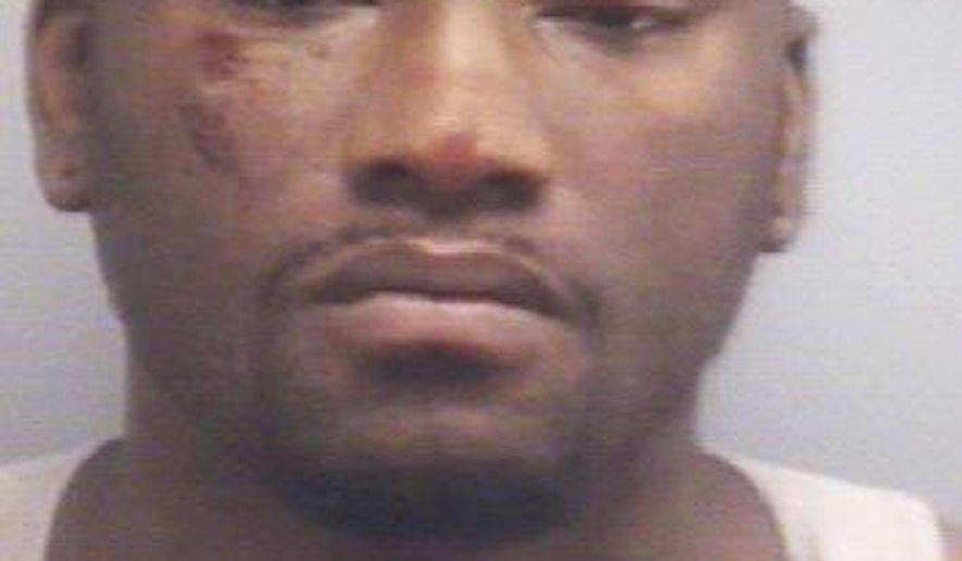 This booking photo provided by the Virginia Beach Police Department shows D'Vondray Terrell McIntyre, 27, of Wylie, Texas, following his arrest early Sunday, May 17, 2015. Virginia Beach police are investigating officers' use of force during the arrest of a McIntyre. Media outlets report that the internal investigation was prompted by cell phone video that shows two officers holding McIntyre on the ground and punching him. A third officer then strikes McIntyre with his knee. (Virginia Beach Police Department via AP)