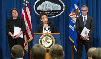 Attorney General Loretta Lynch (center), flanked by Assistant Attorney General Leslie Caldwell, Criminal Division (left) and FBI Assistant Director Andrew McCabe, announces guilty pleas from four large banks for their manipulation of global currency markets. (Associated Press)