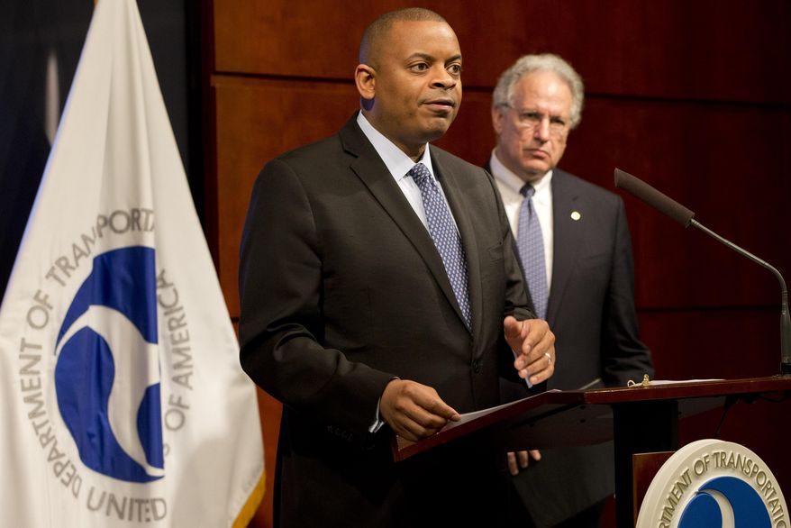 Transportation Secretary Anthony Foxx, left, accompanied by NHTSA Administrator Mark Rosekind, talks about the Takata air bag inflator recall, Tuesday, May 19, 2015, at the Transportation Department in Washington. Air bag maker Takata Corp. has agreed to declare 33.8 million of its inflator mechanisms defective, effectively doubling the number of cars and trucks that have been recalled in the U.S. so far. (AP Photo/Jacquelyn Martin)