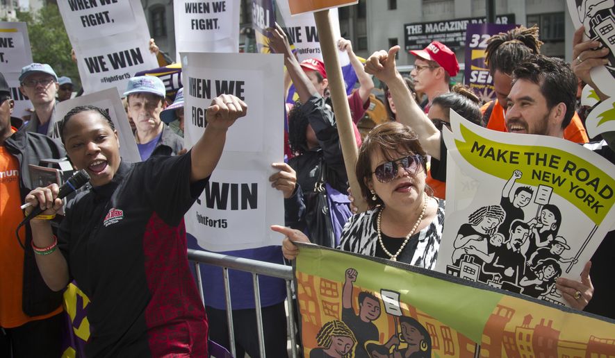 Shantel Walker, 33, left, a worker at Papa John’s Pizza and one of the leaders of the fast food workers movement, speaks during a rally as a state wage board panel prepares to hold its first meeting, Wednesday, May 20, 2015, in New York. The panel, established by Gov. Andrew Cuomo, is considering raising the minimum wage for those in the fast food industry. New York's current minimum wage is $8.75 an hour (AP Photo/Bebeto Matthews)