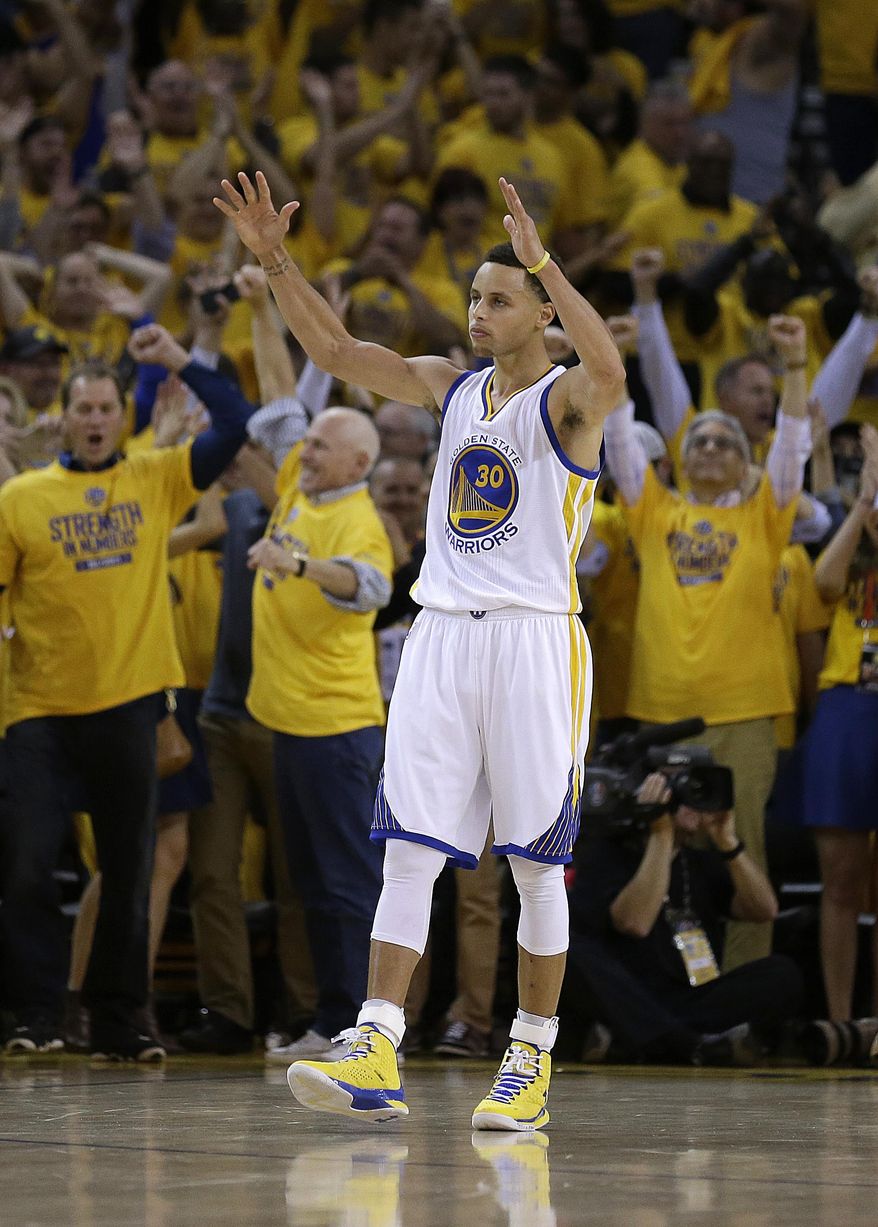 Golden State Warriors&#39; Stephen Curry celebrates the Warriors&#39; 110-106 defeat of the Houston Rockets at the end of Game 1 of the NBA basketball Western Conference finals in Oakland, Calif., Tuesday, May 19, 2015. (AP Photo/Ben Margot)