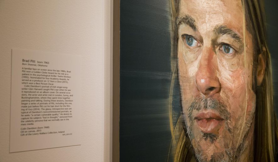 A painting of Brad Pitt by Colin Davidson is among the work on display in "Eye Pop: The Celebrity Gaze," at the National Portrait Gallery, Monday May 18, 2015, in Washington. Brad Pitt, Barbra Streisand, Michelle Obama, and Katy Perry all make the cut. Curators at the National Portrait Gallery are taking a close look at how celebrity images are cultivated and how they’ve evolved in the new exhibition “Eye Pop: The Celebrity Gaze.” (AP Photo/Jacquelyn Martin)