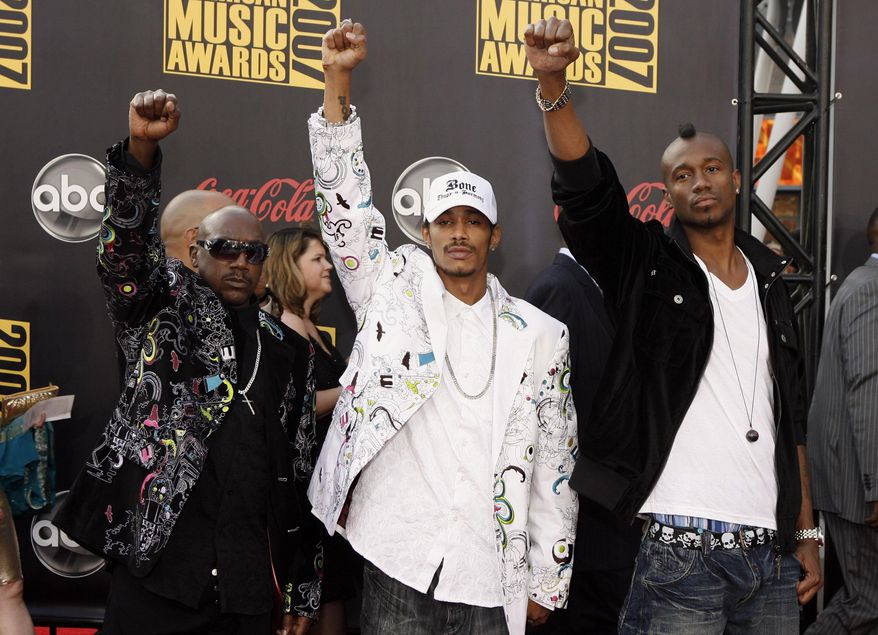 FILE - In this Nov. 18, 2007 file photo, Bone Thugs-N-Harmony, nominated for the favorite rap/hip-hop, duo or group award, arrives at the American Music Awards in Los Angeles. Rapper Layzie Bone, center, of the Grammy Award-winning group Bone Thugs-n-Harmony helped a driver who went into diabetic shock and nearly ran into the performer's vehicle in Wyoming. Casper news station KCWY-TV reports that Steven "Layzie Bone" Howse, was heading to a concert in Riverton on Saturday, May 16, 2015, to promote his new album "Perfect Timing" when he saw a car swerving across the roadway. It spun to a stop in front of the rapper's vehicle. (AP Photo/Matt Sayles, File)
