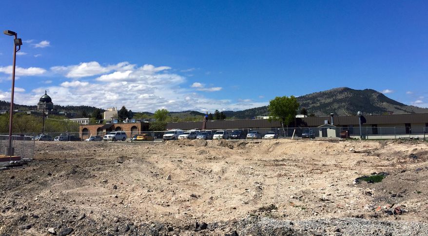 The site of the former Mills Hall where crews have started excavating work in Helena, Mont., Wednesday, May 20, 2015 to build a facility to house offices for the state Department of Natural Resources and Conservation. DNRC officials say they'll have to tighten their budget to afford the rent when they move in next year because lawmakers declined to give them a higher level of funding during the 2015 legislative session. Officials also said leasing the building with fixed rent costs will save money over the 20-year lease. (AP Photo/Lisa Baumann)