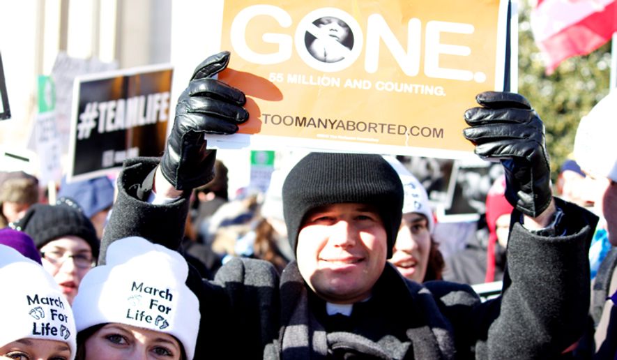 The Radiance Foundation&#39;s website, toomanyaborted.com, is cited in a poster held at a March for Life. (Image courtesy of The Radiance Foundation.)