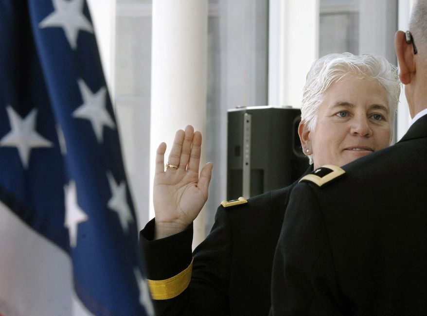 North Dakota National Guard Col. Giselle Wilz takes the oath of office before Maj. Gen. David Sprynczynatyk during a promotion ceremony on Wednesday, May 20, 2015 at the North Dakota Heritage Center in Bismarck. Wilz is first female general in the North Dakota Army National Guard (Mike McCleary/The Bismarck Tribune via AP)