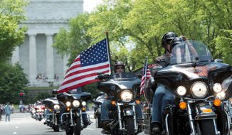 Riders participate in the the annual Rolling Thunder &#39;Ride for Freedom&#39; motorcycle rally, with the Lincoln Memorial in the background, in Washington, Sunday, May 25, 2014. (AP Photo/Molly Riley)