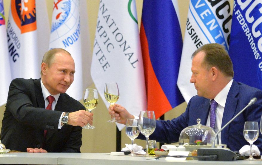 FILE - In this Monday, April 20, 2015 file photo, Russian President Vladimir Putin, left, toasts with Marius Vizer, head of IFJ and SportAccord Convention president, during a reception in Sochi, Russia. The head of umbrella body SportAccord has issued Thursday May 21 2015 a 20-point plan for discussions with the IOC, including the introduction of prize money for Olympic athletes. Marius Vizer also seeks a 50 percent share for all federations in the IOC's new Olympic television channel, and wants all non-Olympic federations to be allowed to demonstrate their sport before or after each games in the host city. (Alexei Druzhinin/RIA Novosti, Kremlin Pool Photo via AP, File)