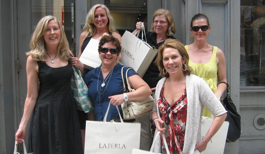 In this May 2011 photo provided by Becky Aikman, Aikman, front row from left, Lesley Jacobs, Tara Nicholson-Olson, and back row from left, Dawn Jiosi, Marcia Wallace and Denise Roy pose outside a shop after buying lingerie in New York. (Becky Aikman via AP)