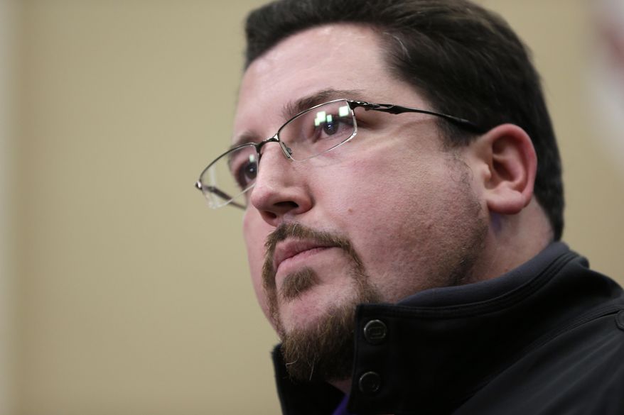 FILE - In this March 11, 2015 file photo, Ferguson Mayor James Knowles III speaks during a news conference in Ferguson, Mo. Ferguson city leaders project a $2.5 million budget shortfall during the current fiscal year and a similar shortage in fiscal 2016, largely due to unrest and fallout after the fatal police shooting of 18-year-old Michael Brown. Knowles told The Associated Press on Thursday, May 21, that layoffs or significant cuts are unlikely. (AP Photo/Jeff Roberson, File)