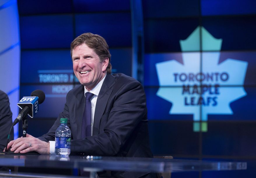 Toronto Maple Leafs&#39; new head coach Mike Babcock laughs during an NHL hockey press conference in Toronto, Thursday, May 21, 2015.  Babcock spent the last 10 seasons with the Detroit Red Wings, where he won the Stanley Cup in 2008. (Darren Calabrese/The Canadian Press via AP) MANDATORY CREDIT