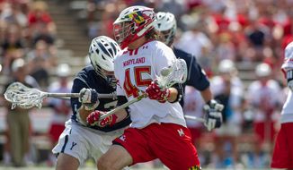 May 9, 2015: Maryland Terrapins Bryan Cole (45) fights off a Yale defender during the NCAA Men&#39;s Division I Championship first round lacrosse game between Yale Bulldogs versus Maryland Terrapins at Capital One Bank Field at Byrd Stadium in College Park, MD.  (Icon Sportswire via AP Images)