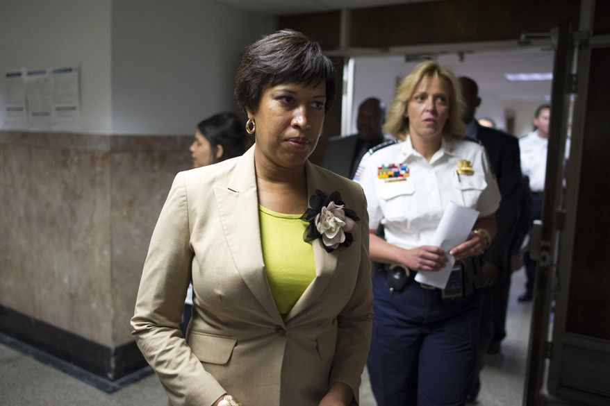 Washington Mayor Muriel Bowser, left, and Police Chief Cathy Lanier, arrives for a news conference in Washington, Thursday, May 21, 2015, to discuss the mysterious slayings of a wealthy Washington family and their housekeeper. (AP Photo/Cliff Owen)