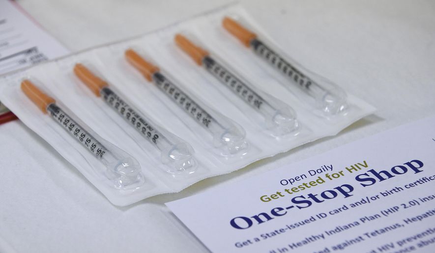 FILE - In this April 21, 2015 file photo, new needles which clients can get as part of the needle exchange program at the Austin Community Outreach Center are displayed in Austin, Ind. Indiana's health commissioner approved a one-year needle-exchange program Thursday, May 21, 2015, for a rural county at the center of the state's largest HIV outbreak, an epidemic that's being driven by needle-sharing among intravenous drug users. The southeastern Indiana county had been operating a temporary needle-exchange under an executive order signed by Gov. Mike Pence that will expire Sunday. (AP Photo/Darron Cummings)