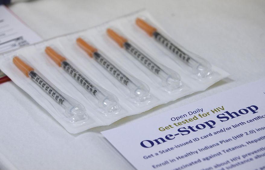 FILE - In this April 21, 2015 file photo, new needles which clients can get as part of the needle exchange program at the Austin Community Outreach Center are displayed in Austin, Ind. Indiana's health commissioner approved a one-year needle-exchange program Thursday, May 21, 2015, for a rural county at the center of the state's largest HIV outbreak, an epidemic that's being driven by needle-sharing among intravenous drug users. The southeastern Indiana county had been operating a temporary needle-exchange under an executive order signed by Gov. Mike Pence that will expire Sunday. (AP Photo/Darron Cummings)