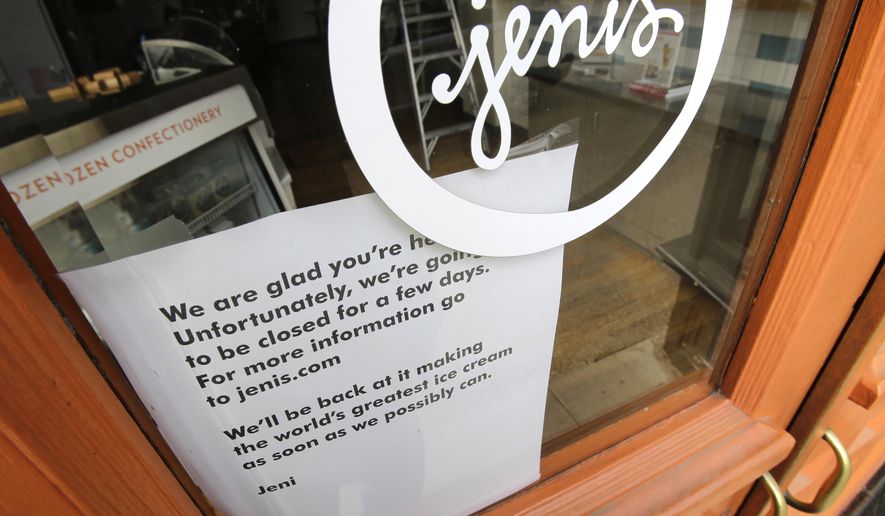 FILE - In this April 24, 2015 file photo, a sign on a window at a Jeni's Splendid Ice Creams states that the store is closed, in Chagrin Falls, Ohio. A government investigation of Ohio-based Jeni's Splendid Ice Creams says there was inadequate testing and cleaning in its Columbus plant before listeria was found in some of its ice cream pints. (AP Photo/Tony Dejak, File)