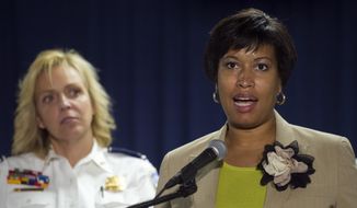 Washington Mayor Muriel Bowser, right, and Police Chief Cathy Lanier, participate in a news conference in Washington, Thursday, May 21, 2015, to discuss the investigation into the mysterious slayings of a wealthy Washington family and their housekeeper. Lanier said investigators believe a suspect in the slayings is in the Brooklyn area of New York City.  (AP Photo/Cliff Owen) **FILE**