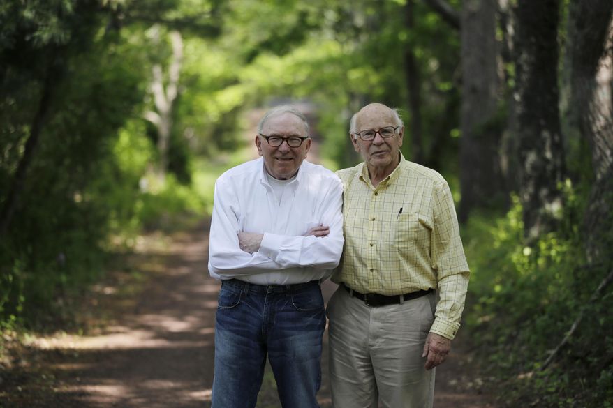 Bill Novak, left, and partner Norman MacArthur pose for a photograph near the couple's home, Friday, May 22, 2015, in Erwinna, Pa. The couple who were legally recognized as father and son has gotten a judge to vacate the adoption now that same-sex partners can get married in Pennsylvania. (AP Photo/Matt Slocum)
