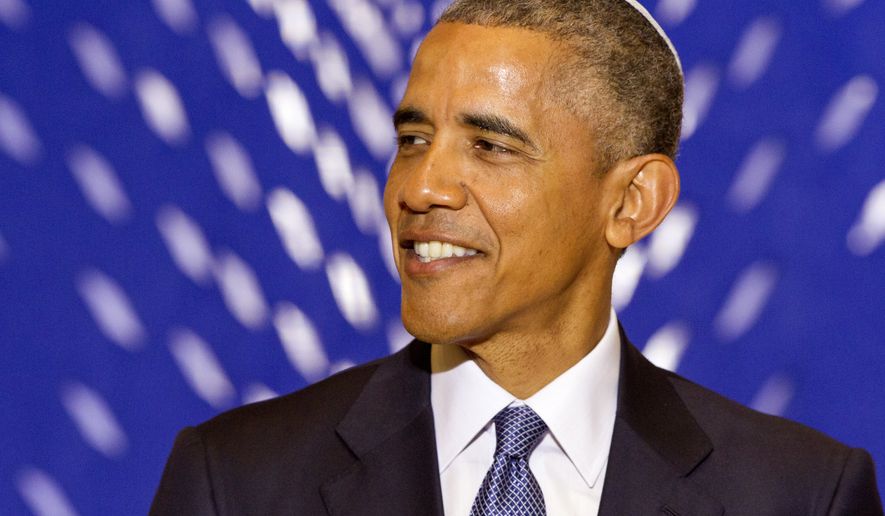 President Barack Obama smiles as he speaks at Adas Israel Congregation in Washington, Friday May 22, 2015, as part of Jewish American Heritage Month. The president addressed one of the largest Jewish congregations in Washington to highlight efforts to combat anti-Semitism, a problem he says has created an intimidating environment worldwide for Jewish families. The appearance coincides with Solidarity Shabbat, devoted to showing unity by political leaders in Europe and North America against anti-Semitism. (AP Photo/Jacquelyn Martin)